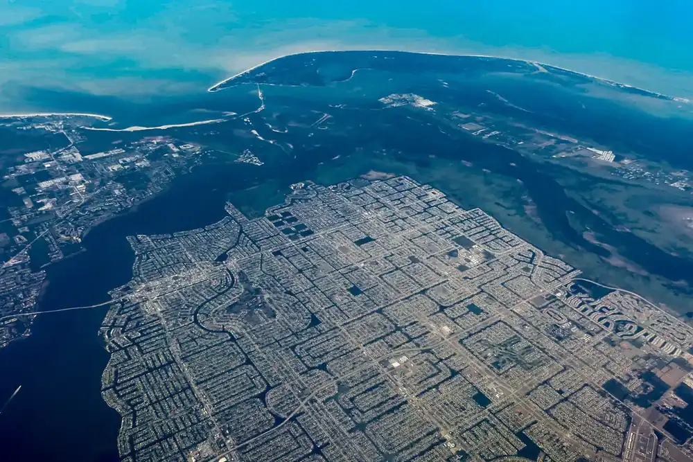 Aerial view of Cape Coral, Florida, with its grid of canals beside the Caloosahatchee River
