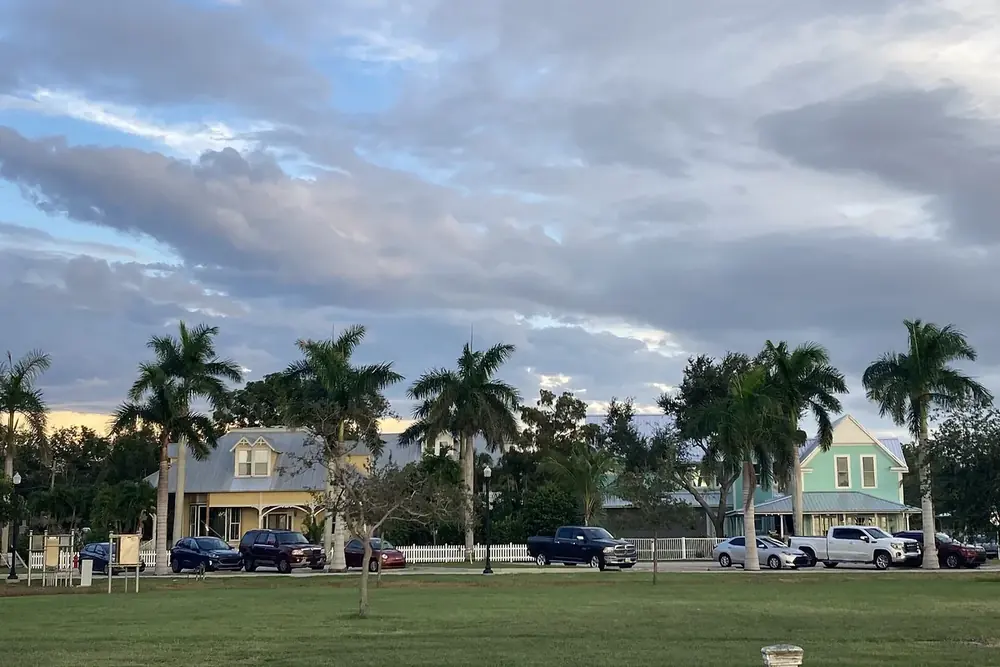 Royal palms and historic district homes along Gilchrist Park in Punta Gorda, Florida